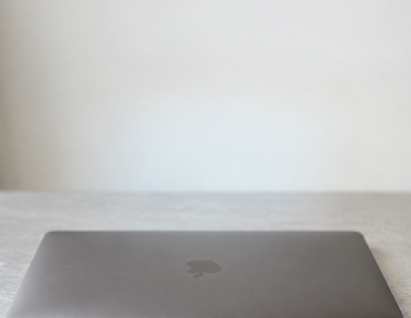 A closed laptop on a quiet desk